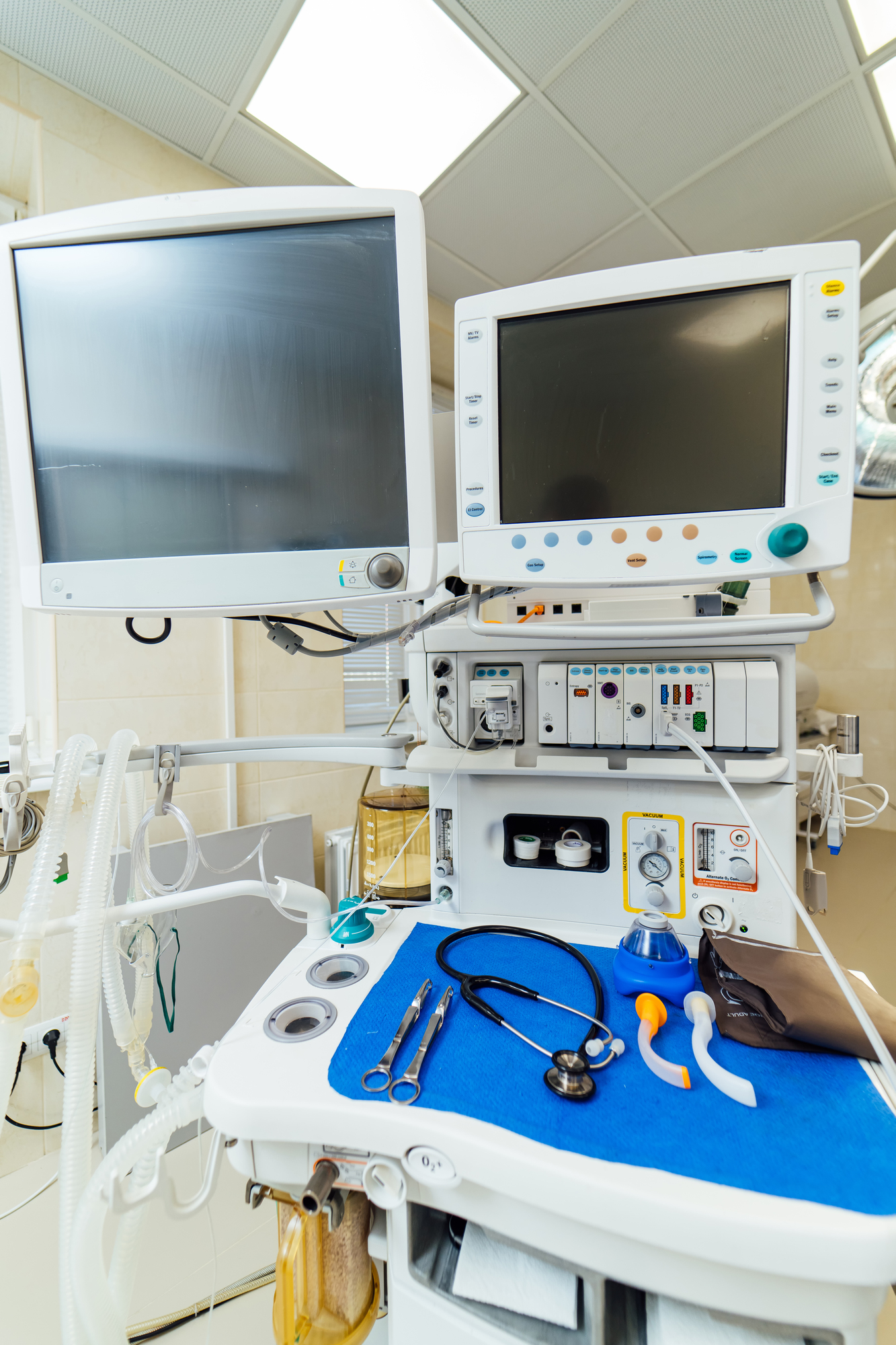 Medical equipment setup with monitors and various instruments.